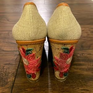 Peep toe wedges with embroidered detailing